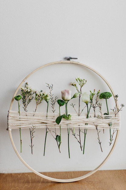 Three embroidery hoops with finished designs